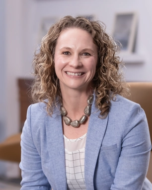 portrait of a smiling person in professional attire